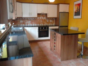 After the makeover of Rachel's kitchen by Kitchen Makeover, Ireland. The two tone walnut and cream finish is a classic combination.