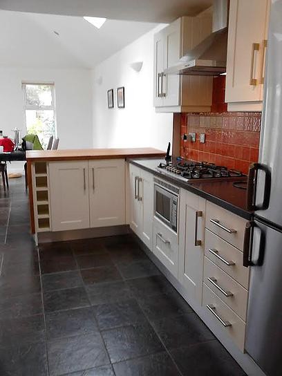 After the makeover of Shane & Orla's kitchen by Kitchen Makeover, Ireland. A new counter was added to define the kitchen area.