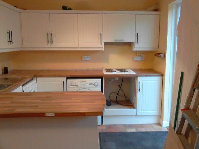 Sophie's kitchen afterrefurbishment by Kitchen Makeover, Ireland.  Ivory doors and walnut worktop are a classic combination